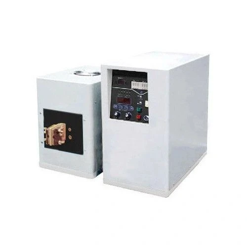 Induction Heaters, white control cabinet with panel beside a smaller unit with copper terminals