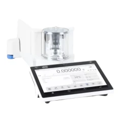 Radwag 2.1g 0.1ug Microbalance, round glass draft shield on white housing with separate touchscreen terminal