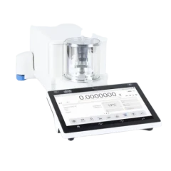 Radwag 6.1g 0.1ug Mass Comparator, small glass weighing chamber on white housing beside a wide touchscreen