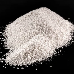 Activated Alumina 14 kg, 7 Gallon, heap of white granules on a black background
