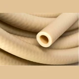 3/8" Santoprene Chiller and Heater Tubing, coiled beige tubing with cut end close-up