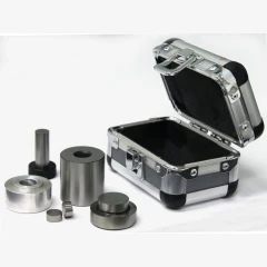 Ai 13mm Dry Pressing Die Set, steel sleeve, plunger and discs beside an open aluminum carry case