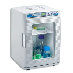 Benchmark MyTemp Mini Incubator, Heating Only, white benchtop unit with glass door, display and bottles on a shelf
