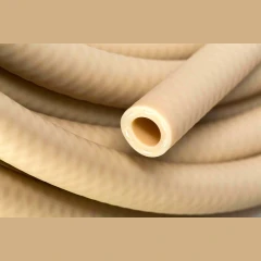 3/8" Reinforced Vacuum Chilling Tubing, close-up of coiled beige tubing with cut end