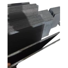 Silicon Carbide High Temperature Plate, stacks of dark grey speckled flat plates, close-up