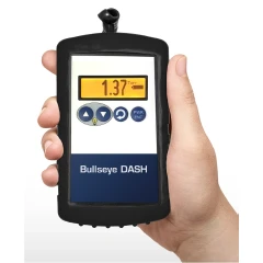 DigiVac Bullseye DASH High Vacuum Controller, black handheld unit with lit display and buttons held in a hand