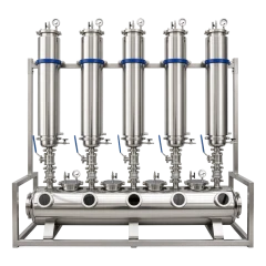 50lb 5-Column Closed Loop Extractor, five stainless columns on a frame over a horizontal collection tank