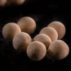 4A molecular sieve beads, tan spheres on a dark background – view 2