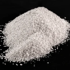 Activated Alumina granules, heap of white granules on a dark background